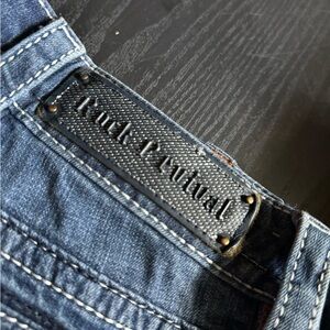 Rock Revival Blue Jeans with Contrast Stitching and Leather Patch
